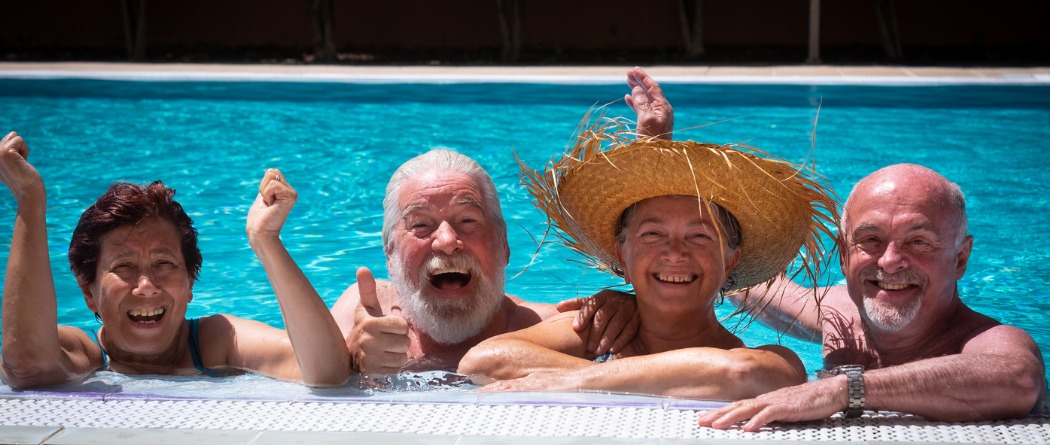 Older couples having fun in a swimming pool