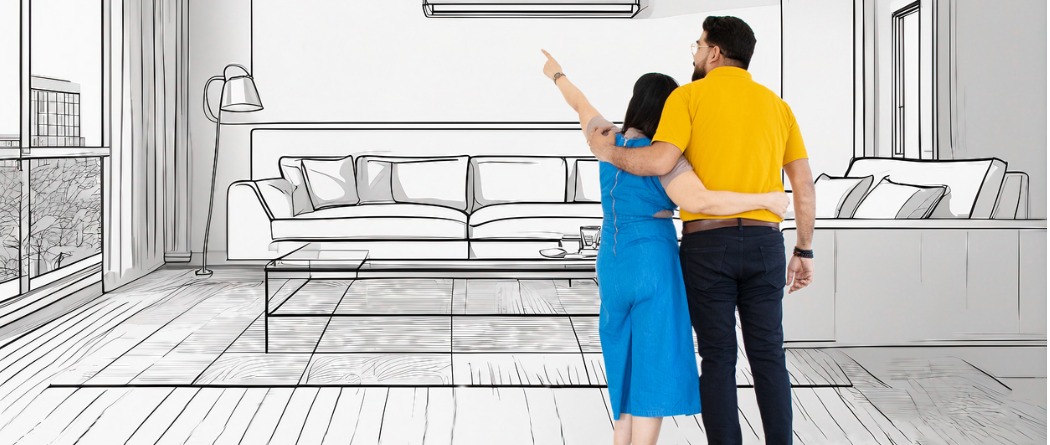 A woman and man are looking at the sketch of their home improvements