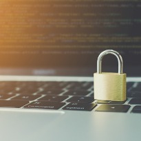 a paddle lock sitting on a keyboard